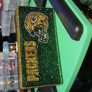 Vintage hand held clutch that's embellished wGlass rhinestones& green bay packer